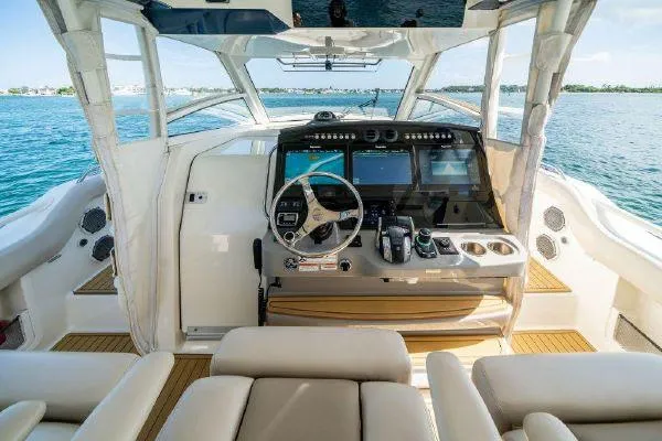 Slide: The Image of 2017 Boston Whaler 42 OUTRAGE helm with advanced navigation systems and luxurious seating. - 33