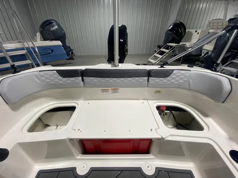 Slide: The Image of 2024 Bayliner Element M15 boat interior with seating and storage compartments. - 10