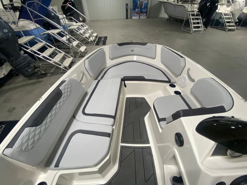 Slide: The Image of 2024 Bayliner Element M15 boat interior with spacious seating and modern design. - 12