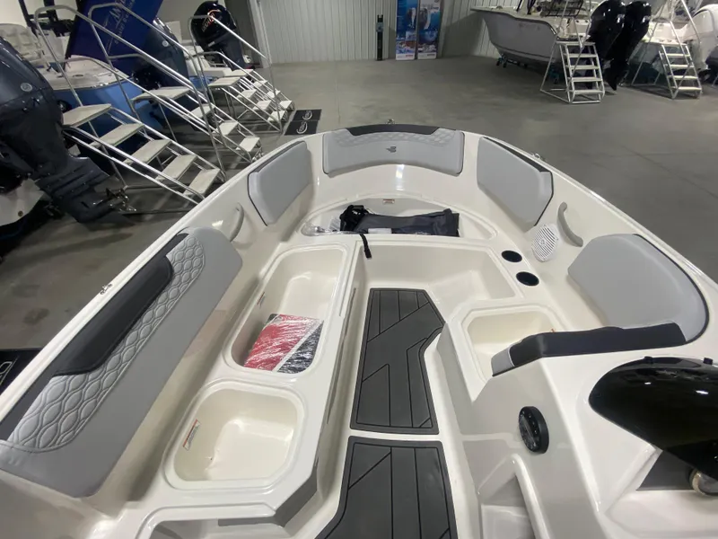 Slide: The Image of 2024 Bayliner Element M15 boat interior with seating and storage compartments. - 14