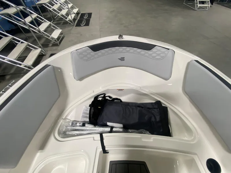 Slide: The Image of 2024 Bayliner Element M15 boat interior with storage compartment. - 16