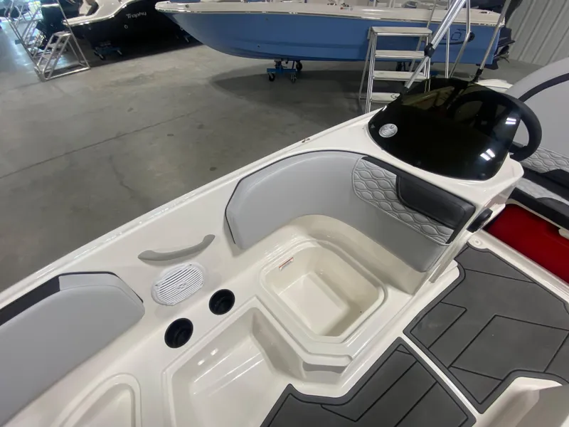 Slide: The Image of 2024 Bayliner Element M15 boat interior with seating and storage compartments. - 17