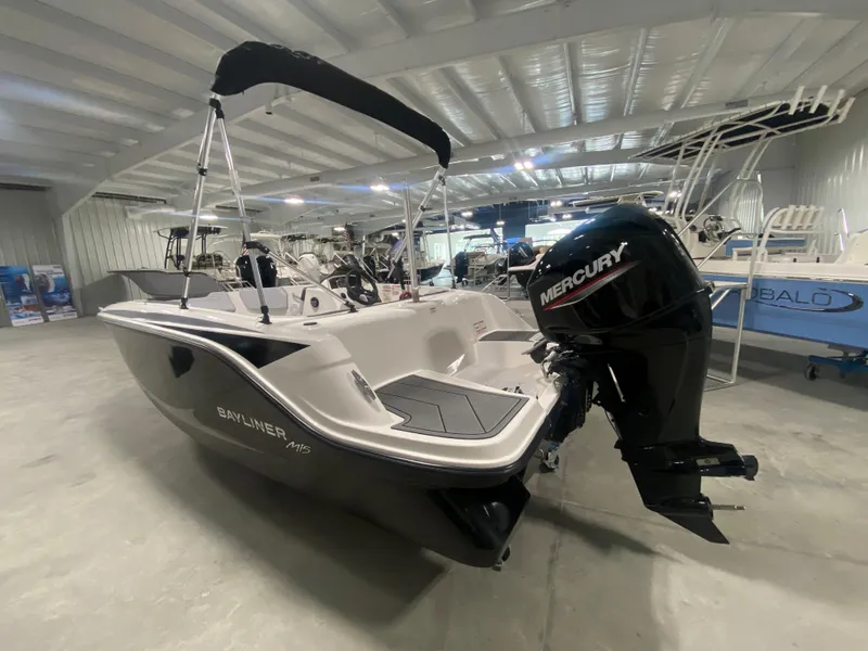 Slide: The Image of 2024 Bayliner Element M15 boat with Mercury outboard motor in showroom. - 4