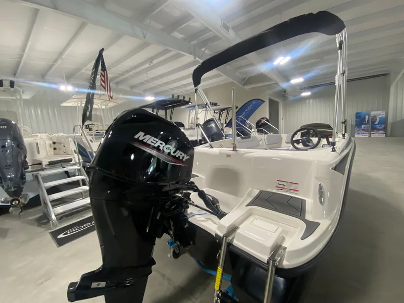 Slide: The Image of 2024 Bayliner Element M15 boat with Mercury outboard motor in showroom. - 5