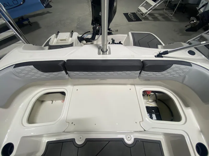 Slide: The Image of 2024 Bayliner Element M15 boat interior, rear seating and storage compartments. - 9