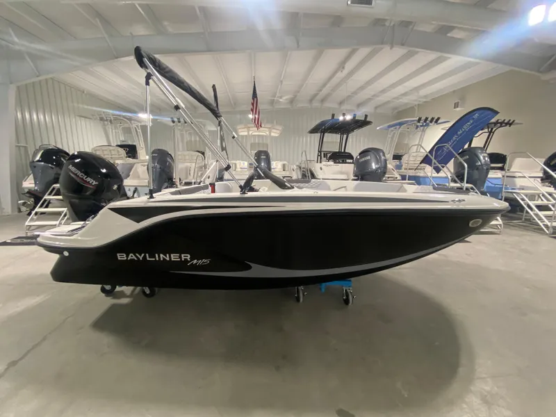 Slide: The Image of 2024 Bayliner Element M15 boat in showroom, side view. - 1