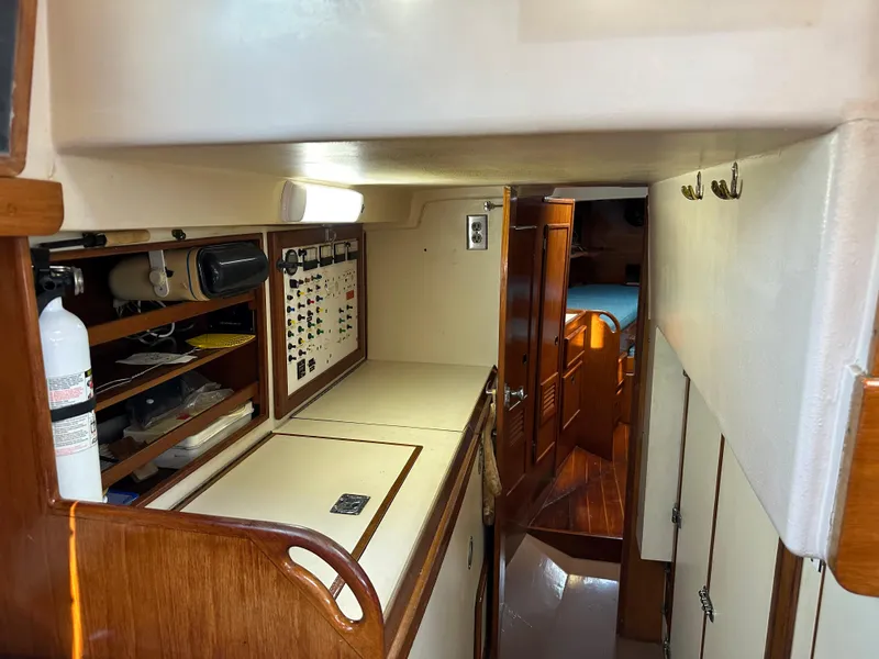 Slide: The Image of Interior of 1983 Brewer 42 Center Cockpit sailboat with wooden cabinetry and storage. - 14