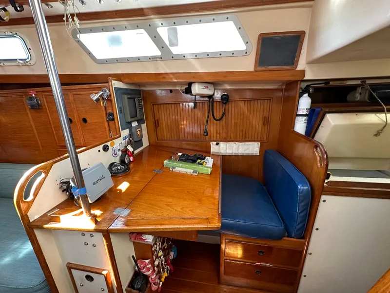 Slide: The Image of Interior of 1983 Brewer 42 Center Cockpit sailboat with navigation station and seating. - 19