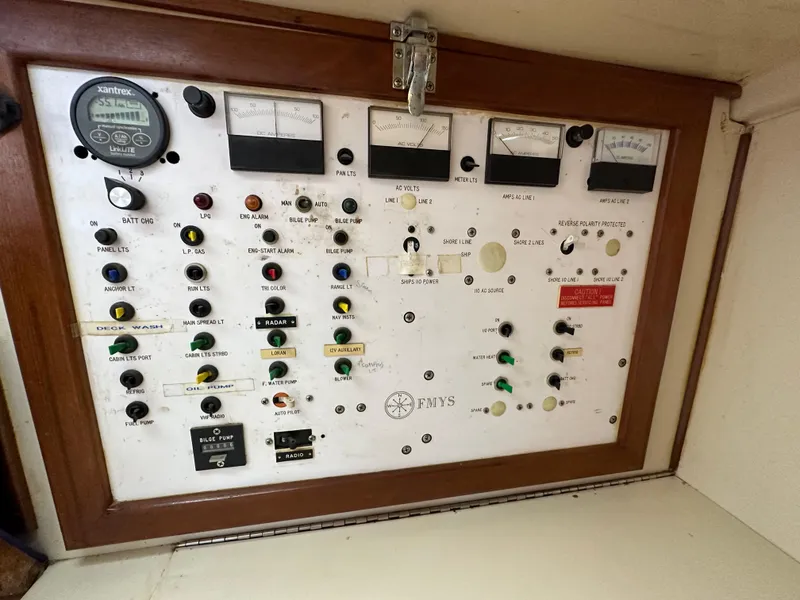 Slide: The Image of Electrical control panel of a 1983 Brewer 42 Center Cockpit sailboat with gauges and switches. - 20