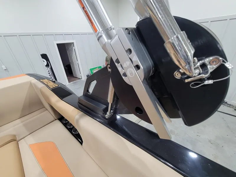 Slide: The Image of 2024 MasterCraft NXT22 boat interior with close-up of wakeboard tower. - 16