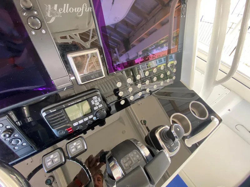 Slide: The Image of Control panel of a 2013 Yellowfin 39 boat with navigation and communication equipment. - 10