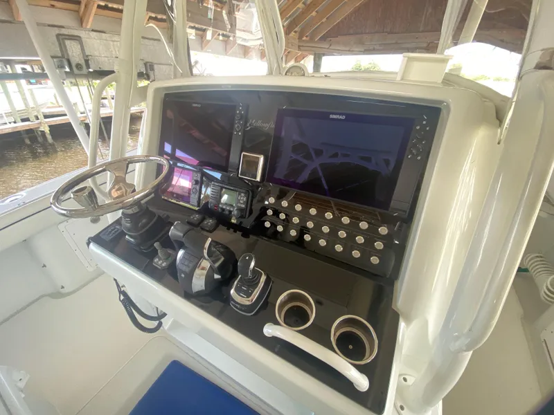 Slide: The Image of 2013 Yellowfin 39 boat dashboard with advanced navigation and control systems. - 12