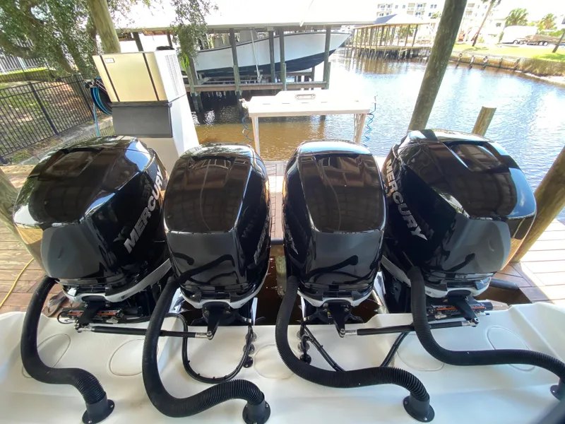 Slide: The Image of 2013 Yellowfin 39 boat with four Mercury outboard engines docked. - 16