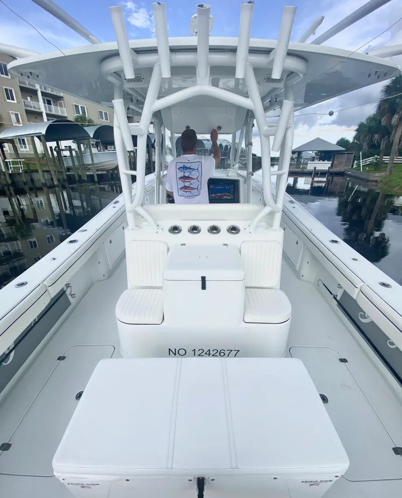 Slide: The Image of 2013 Yellowfin 39 boat interior with seating and rod holders. - 22
