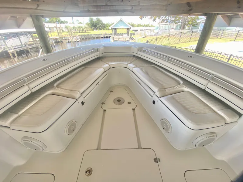 Slide: The Image of 2013 Yellowfin 39 boat with spacious seating area and storage compartments. - 24