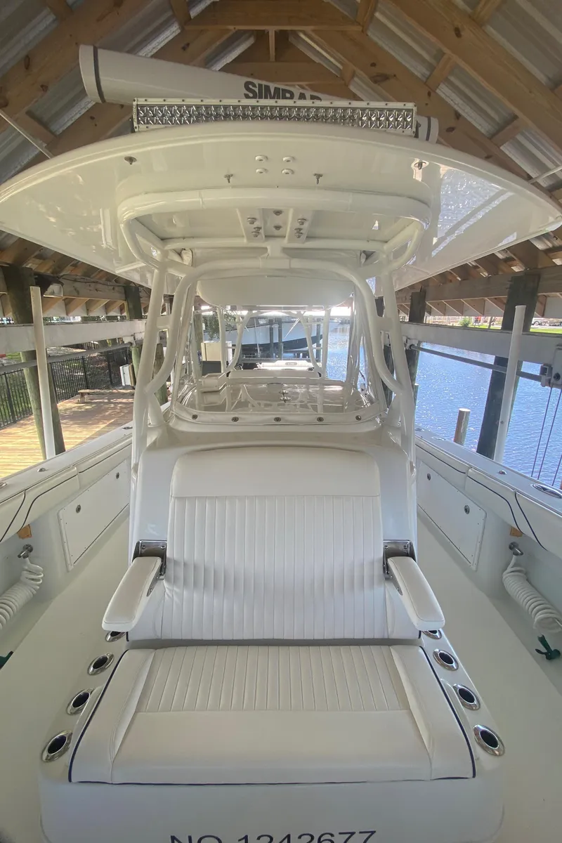 Slide: The Image of 2013 Yellowfin 39 boat interior under a covered dock. - 26
