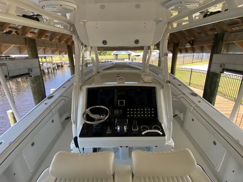 Slide: The Image of 2013 Yellowfin 39 boat helm station under covered dock. - 28