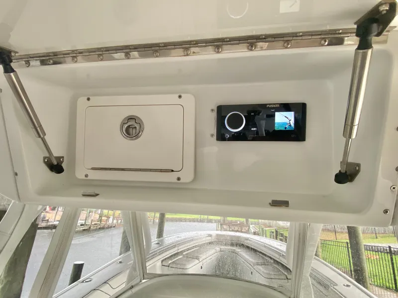 Slide: The Image of 2013 Yellowfin 39 boat console with storage compartment and electronic display. - 29