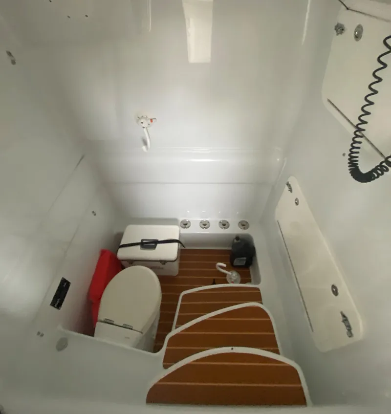 Slide: The Image of 2013 Yellowfin 39 boat interior with toilet, storage, and wooden floor. - 31