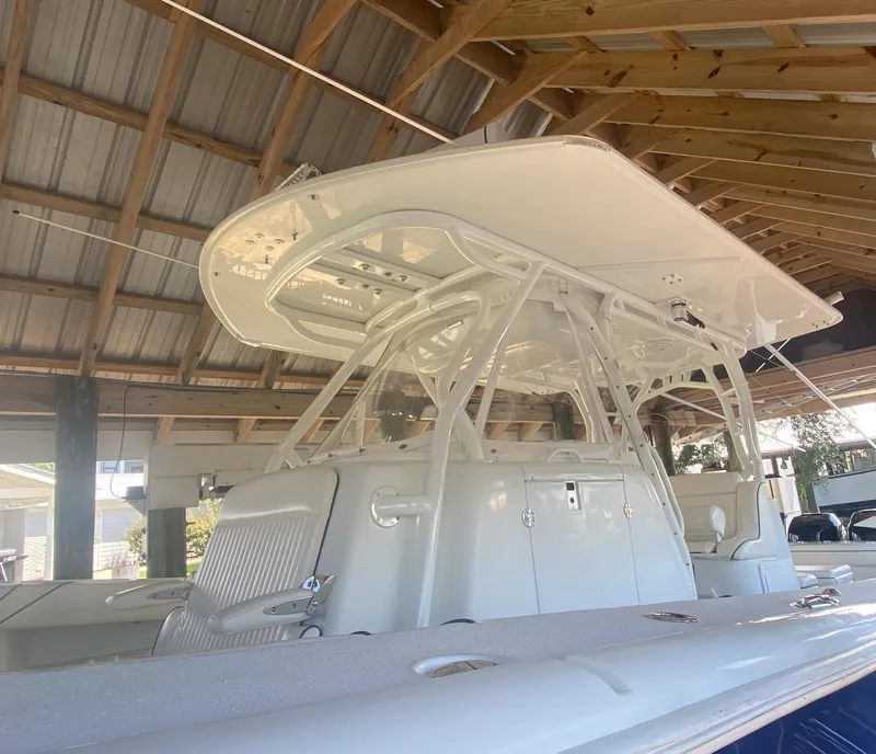 Slide: The Image of 2013 Yellowfin 39 boat under a wooden roof structure. - 33