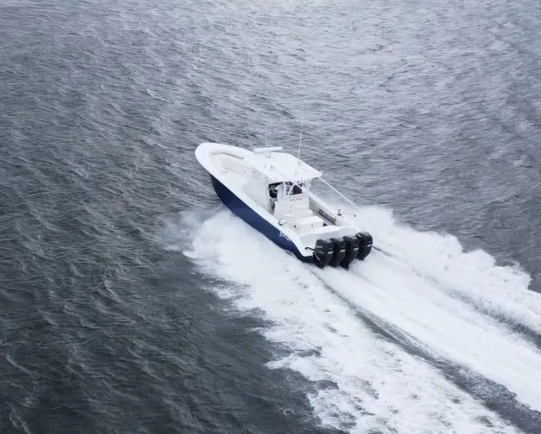 Slide: The Image of 2013 Yellowfin 39 boat cruising on open water. - 36