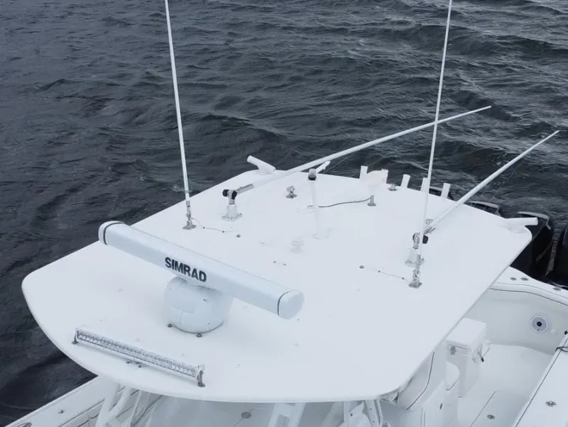 Slide: The Image of 2013 Yellowfin 39 boat with Simrad radar on the water. - 37