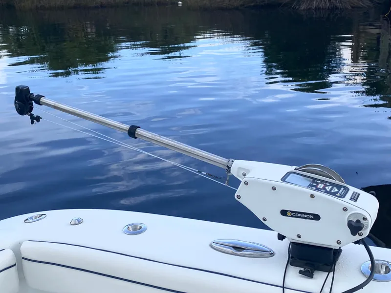 Slide: The Image of Fishing equipment on a 2013 Yellowfin 39 boat by the water. - 39