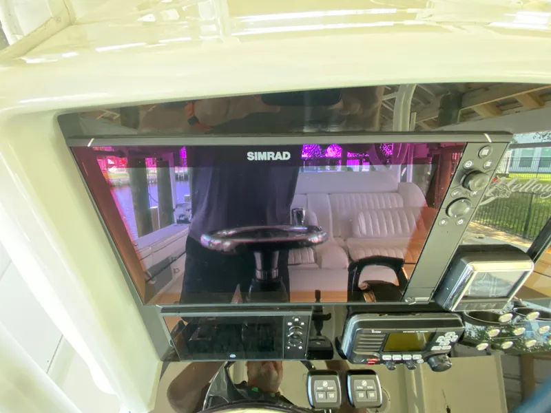 Slide: The Image of Simrad navigation system on 2013 Yellowfin 39 boat dashboard. - 41