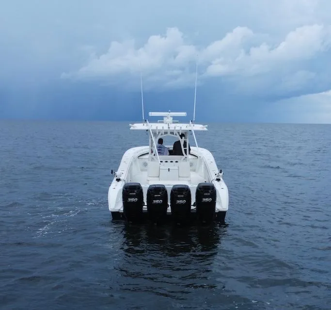 Slide: The Image of 2013 Yellowfin 39 boat with quad 350 engines on open water. - 7