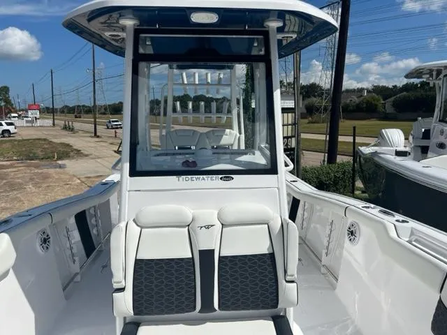 Slide: The Image of 2024 Tidewater 292 CC Adventure boat interior with seating and console. - 15