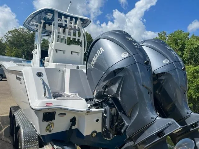 Slide: The Image of 2024 Tidewater 292 CC Adventure boat with twin Yamaha engines. - 3