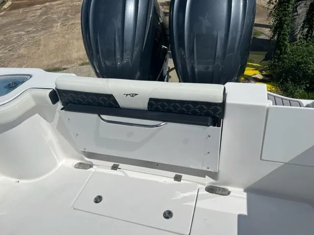 Slide: The Image of 2024 Tidewater 292 CC Adventure boat with dual outboard engines. - 6