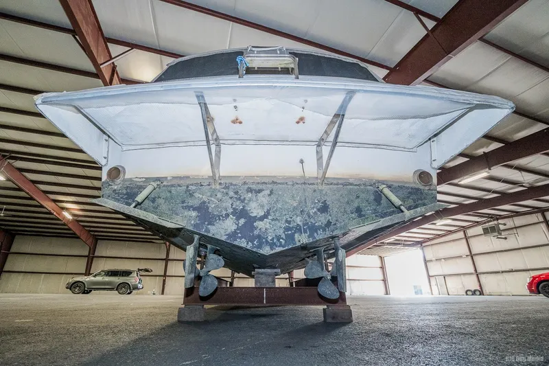 Slide: The Image of 1987 Chris-Craft 320 Amerosport Express boat in storage facility. - 12