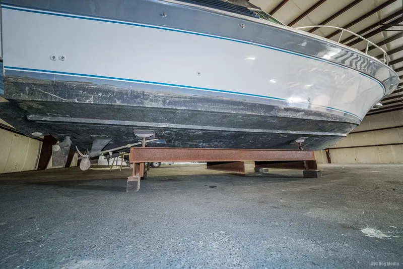 Slide: The Image of 1987 Chris-Craft 320 Amerosport Express boat in storage, viewed from below. - 14