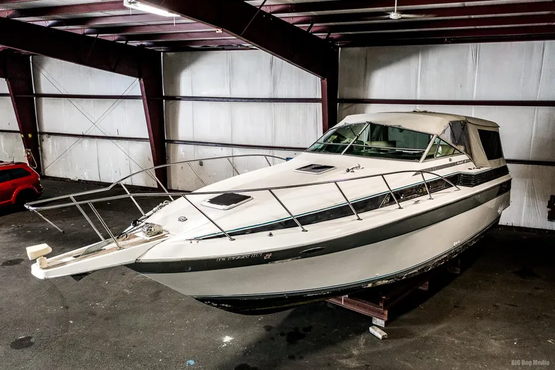 Slide: The Image of 1987 Chris-Craft 320 Amerosport Express boat in indoor storage. - 4
