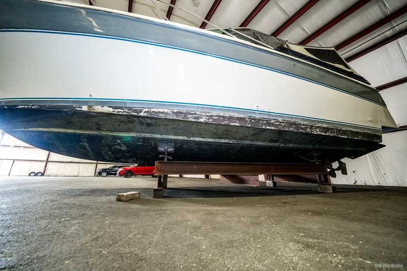 Slide: The Image of 1987 Chris-Craft 320 Amerosport Express boat in storage, side view. - 9