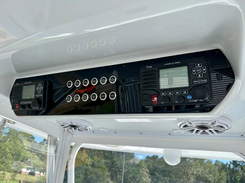 Slide: The Image of Control panel of a 2021 Freeman 37VH boat with electronic displays and buttons. - 12