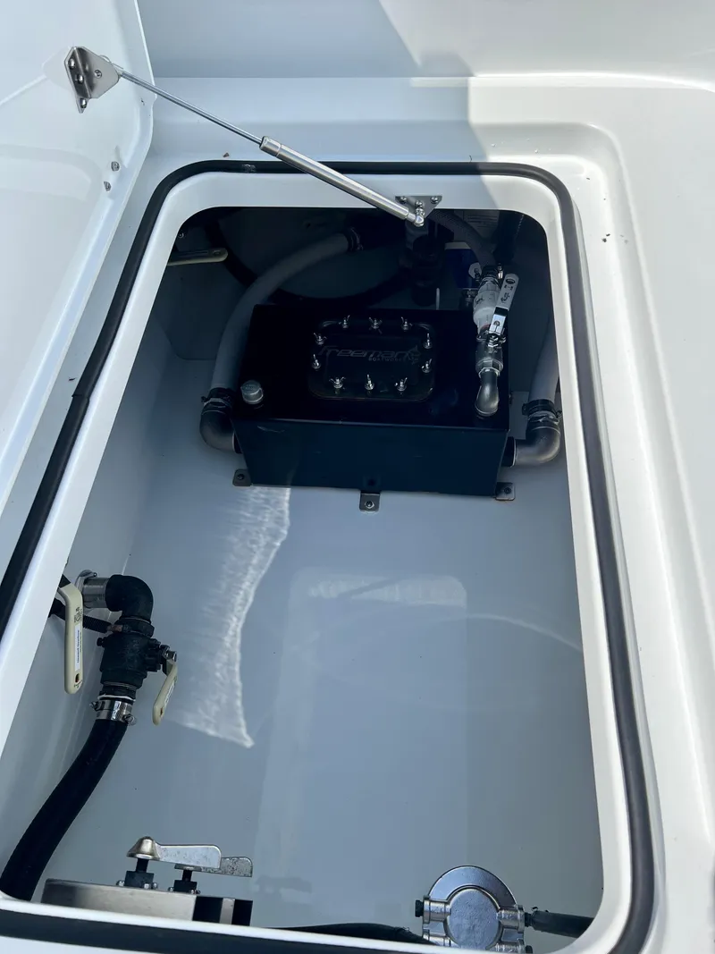 Slide: The Image of Freeman 37VH 2021 boat compartment with mechanical components and hoses. - 15