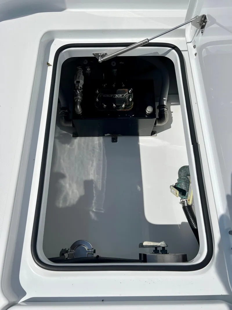 Slide: The Image of 2021 Freeman 37VH boat storage compartment with mechanical components. - 16