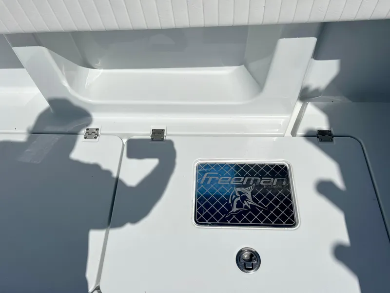 Slide: The Image of 2021 Freeman 37VH boat deck with logo and shadows. - 17