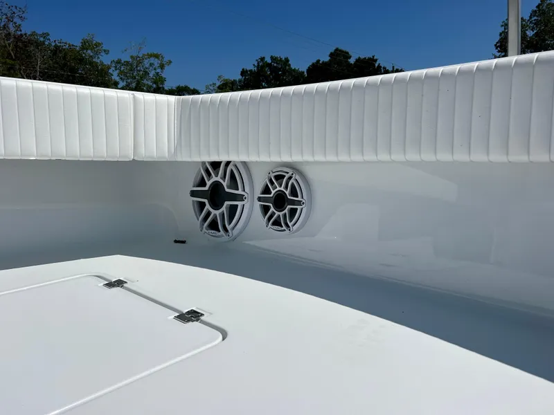 Slide: The Image of 2021 Freeman 37VH boat interior with white speakers and cushioned seating. - 21