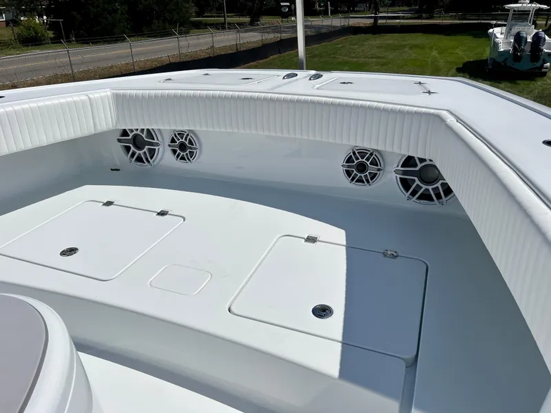 Slide: The Image of Freeman 37VH 2021 boat deck with storage compartments and speakers, showcasing sleek design. - 26