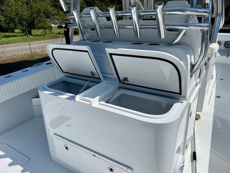 Slide: The Image of Freeman 37VH 2021 boat with open storage compartments and rod holders. - 29