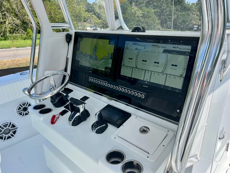 Slide: The Image of 2021 Freeman 37VH boat dashboard with dual navigation screens and controls. - 30