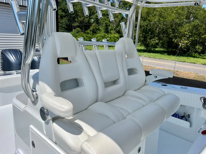 Slide: The Image of Luxurious white seating on a 2021 Freeman 37VH boat, featuring sleek design and chrome accents. - 31