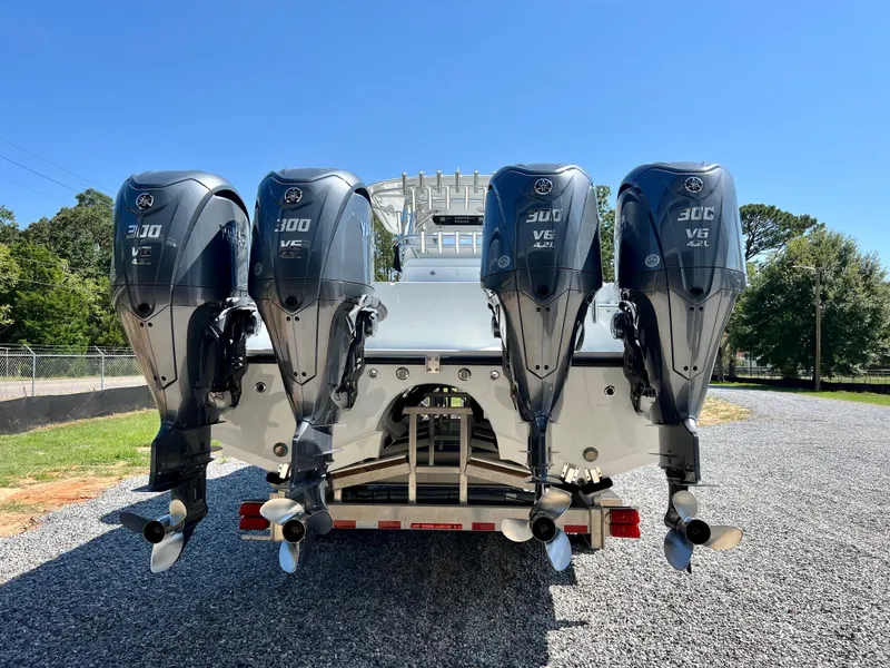 Slide: The Image of Freeman 37VH 2021 boat with four powerful outboard engines on a trailer. - 6