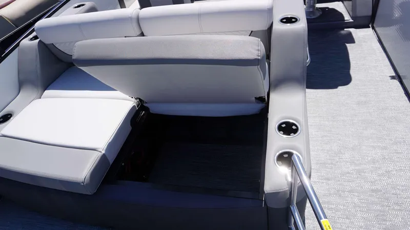 Slide: The Image of 2024 MONACO 235 DFL boat interior with adjustable seating and cup holders. - 10
