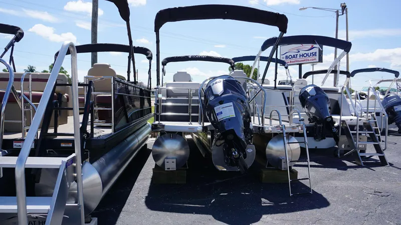 Slide: The Image of 2024 MONACO 235 DFL pontoon boats displayed at The Boat House dealership. - 14