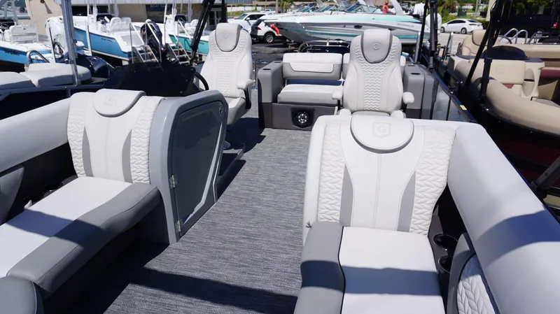 Slide: The Image of 2024 MONACO 235 DFL pontoon boat interior with luxurious seating and modern design. - 15