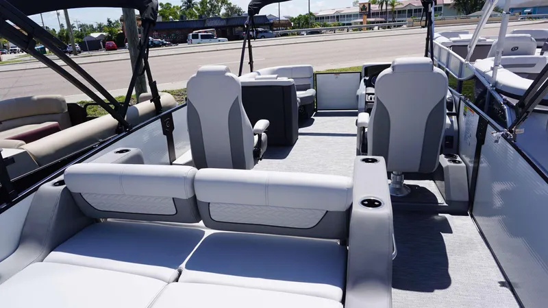 Slide: The Image of 2024 MONACO 235 DFL pontoon boat interior with luxurious seating and modern design. - 5